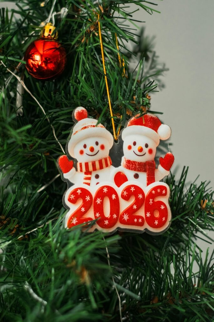 2026 Christmas tree snowman ornament with red decoration.